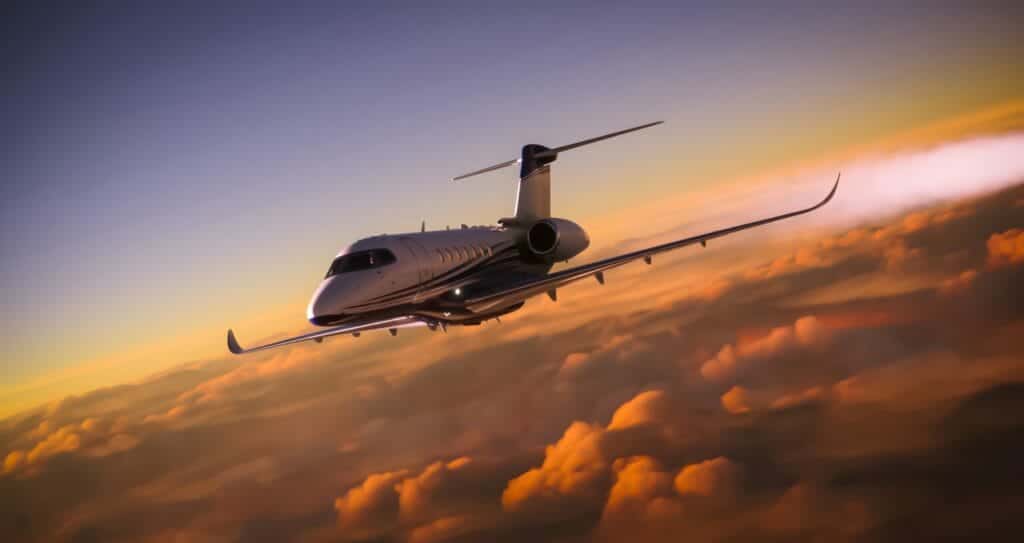 Luxury Jet flying in the air above the clouds