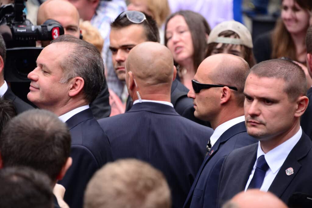 Professional security team attentively safeguarding a VIP in a crowded event, illustrating Global Risk Solutions, Inc., expert personal security detail services.