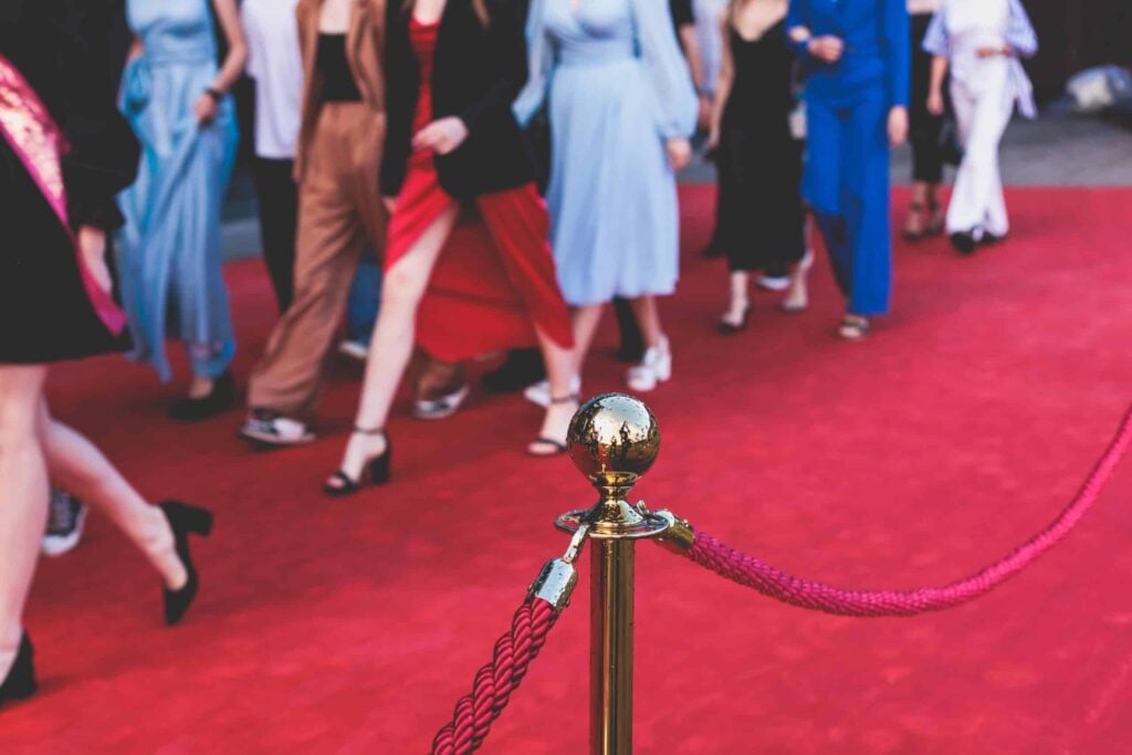 A roped-off red carpet event with attendees in formal attire, showcasing the professional Red Carpet Event Security services provided by Global Risk Solutions, Inc.
