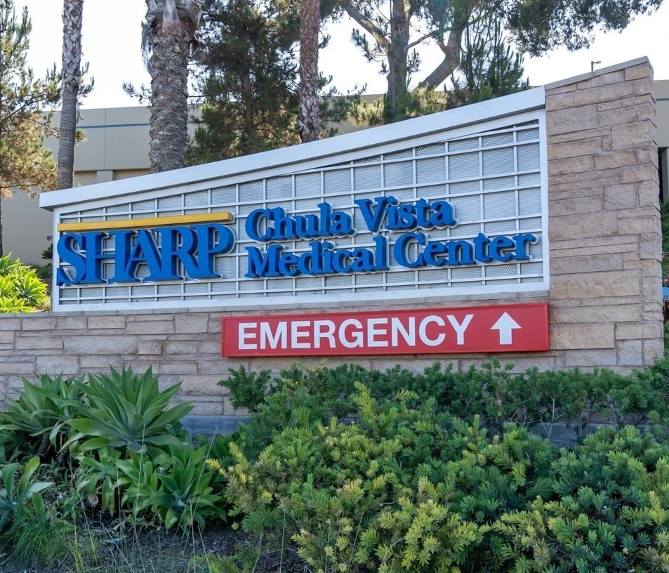 Sharp Chula Vista Medical Center sign with an emergency arrow, highlighting the importance of evacuation protocols for executives during critical situations.