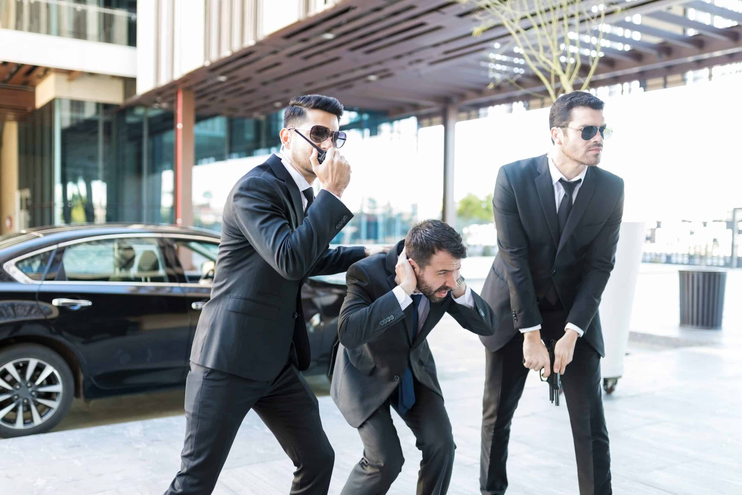 Close Protection Incident Management with agents securing a VIP during a tactical emergency scenario.