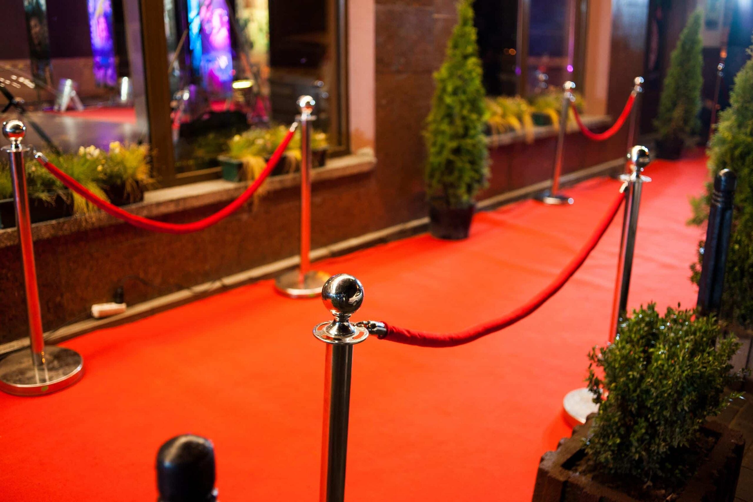 Event Security for Belle Meade with controlled red carpet access and perimeter stanchions at a private venue entrance.
